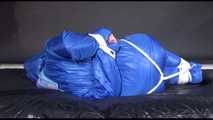 Lucy tied and gagged with ropes on bed wearing sexy blue oldschool downwear (Video)
