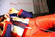 Sonja ties, gagges and hoodes herself on bed wearing a supersexy oldschool shiny nylon downwear (Pics)