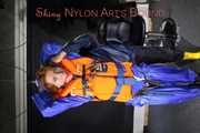 See Ronja tied and gagged by Stella in shiny nylon Rainwear and a Life Vest!