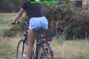 Watch Sandra riding her bike enjoying her shiny nylon shorts