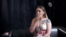 Tattooed girl is smoking a marlboro red