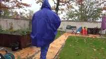 Watching sexy Pia wearing sexy blue shiny nylon rainwear and yellow rubber boots raking leaves (Video)