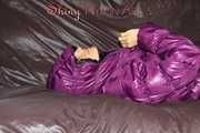 Watching sexy Sandra wearing a black rain pants and a purple down jacket playing with the closed hood (Pics)