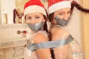 Olivia and Niki - New Year wrapping and tape bondage for both