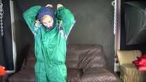 Watching sexy Sandra putting on three rainwear combinations one over the other, hooded (Video)