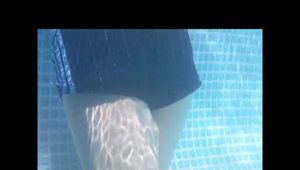 SEXY MARA wearing an oldschool blue shiny nylon shorts and an oldschool shiny nylon rain jacket swimming in the pool (Video)