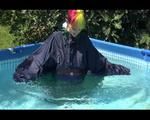 Mara wearing sexy shiny nylon rainwear while taking a bath in the swimming pool (Video)