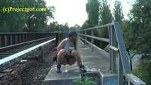 020157 Kathy Takes A Pee From The Railway Bridge