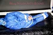 LUCY tied, gagged and hooded with ropes and a cloth gag on bed wearing a sexy blue shiny nylon down suit (Pics)