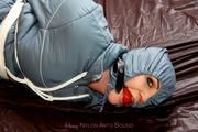 Jill tied and gagged in a shiny nylon oldschool skisuit