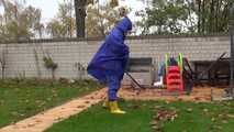 Watching sexy Pia wearing sexy blue shiny nylon rainwear and yellow rubber boots raking leaves (Video)