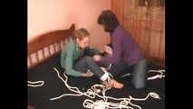 Catt and Alexa - Naughty girl tied up before joining helpless girlfriend on the bed (video)