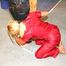 Jill tied and gagged by an blond archive girl on a pillar both wearing shiny nylon rainwear (Pics)