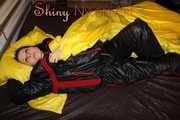 Watching sexy Lucy preparing her bivouac in shiny nylon linen wearing a supersexy black/red oldschool downsuit (Pics)