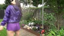 Watching Aiyana wearing a sexy purple shiny nylon shorts and a purple rain jacket while taking a shower in the garden (Video)