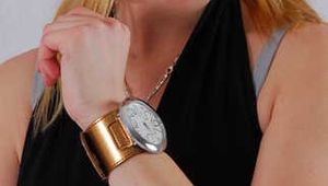 Kylie wearing her own Geneva huge cuff watch 