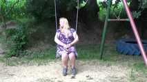 Miri cuffed on a swing