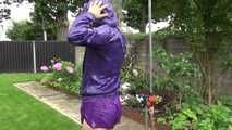 Watching Aiyana wearing a sexy purple shiny nylon shorts and a purple rain jacket while taking a shower in the garden (Video)