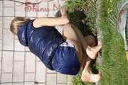 Sexy Sandra wearing a sexy darkblue shiny nylon shorts and a blue downvest during her gardening work (Pics)