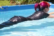 Mara sunbathing and swimming in the pool wearing a supersexy black adidas shiny nylon rainwear (Pics)