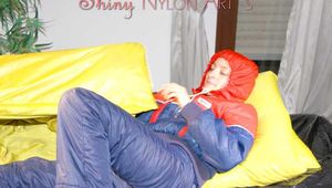 ***HOT HOT HOT*** SONJA wearing a sexy oldschool blue/red shiny nylon down suit while preparing her bed (Pics)