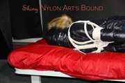 Sonja being tied, gagged and hooded on a shiny nylon bed with ropes and a clothgag wearing a supersexy shiny nylon rain pants and a black down jacket with fur (Pics)