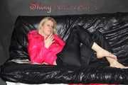 Watching sexy Pia wearing  a sexy black shiny nylon rain pants and a pink down jacket enjoying herself and lolling on the sofa (Pics)