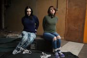 Anija v Katie Sweater hogties in sneakers