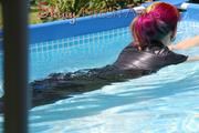 Mara sunbathing and swimming in the pool wearing a supersexy black adidas shiny nylon rainwear (Pics)