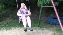 Miri cuffed on a swing