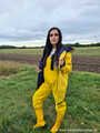 Miss Amira on the road in a Frisian mink, yellow rain dungarees and rubber boots