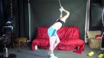 Watching ***NEW MODELL COURTNEY*** wearing a sexy lightblue shiny nylon shorts and a black top being tied and gagged overhead with ropes and a ballgag (Video)