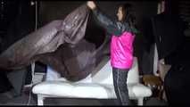 Watching Mara preparing her sofa with shiny nylon cloth wearing a sexy rainwear combination (Video)