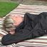 Watching Sonja lying in the garden lolling on the floor and watering the flowers wearing sexy black shiny nylon rainwear (Video)