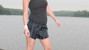 Enni outdoor wearing a sexy black shiny nylon shorts and a black top (Pics)