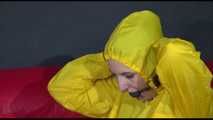 ***MARA*** ties and gagges with cuffs on the sofa wearing a supersexy oldschool yellow rain suit with hood (Video)