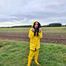 Miss Amira on the road in a Frisian mink, yellow rain dungarees and rubber boots