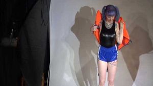Mara wearing a sexy shiny swimsuit and a shiny nylon shorts trying on a lifevest (Video)