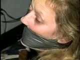 43 YEAR OLD WAITRESS IS TAPE BALL-TIED, TAPE HOG-TIED, BAREFOOT, TOE-TIED & WRAP TAPE GAGGED (D62-10)