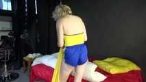 *** Sexy MIA wearing a blue shiny nylon shorts and a yellow top during changing the cloths on her bed  (Video)***