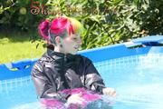 Mara wearing a supersexy 3/4 adidas pants and a supershiny pink/black rain jacket while sun bathing and go swimming in the pool (Pics)