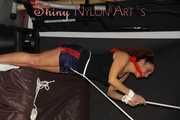 Watching sexy Stella and Sandra both wearing a hot shiny nylon shorts and a top being tied and gagged overhead with ropes and a ballgag (Pics)