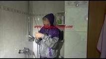 Mara wearing a sexy purple/silver pvc combination tied and gagged on a shower (Video)