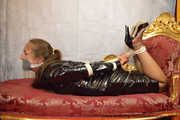 Miss Scarlett bound and gagged in full PVC outfit and transparent raincoat