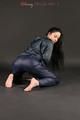 Beautiful black haired archive girl posing in front of the camera for you wearing supersexy darkblue rainwear with zipper (Pics)