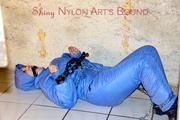 Jill tied, gagged anmd hooded with old handcuffs lying in an old cellar wearing a sexy lightblue skibib (Pics)