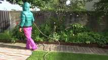 Watching Sandra taking a sun bath and watering the garden the pest plants wearing a sexy purple rain pants and a green down jacket (Video)