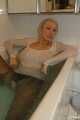 Busty Anna takes a hot bath in her pantyhose