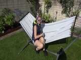 Watch Chloe enjoying her shiny nylon Downwear outside at a sunny Day