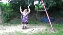 Miri cuffed on a swing